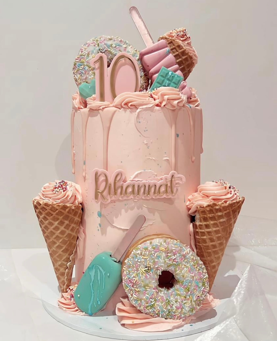 Pink drip sprinkle doughnut cake