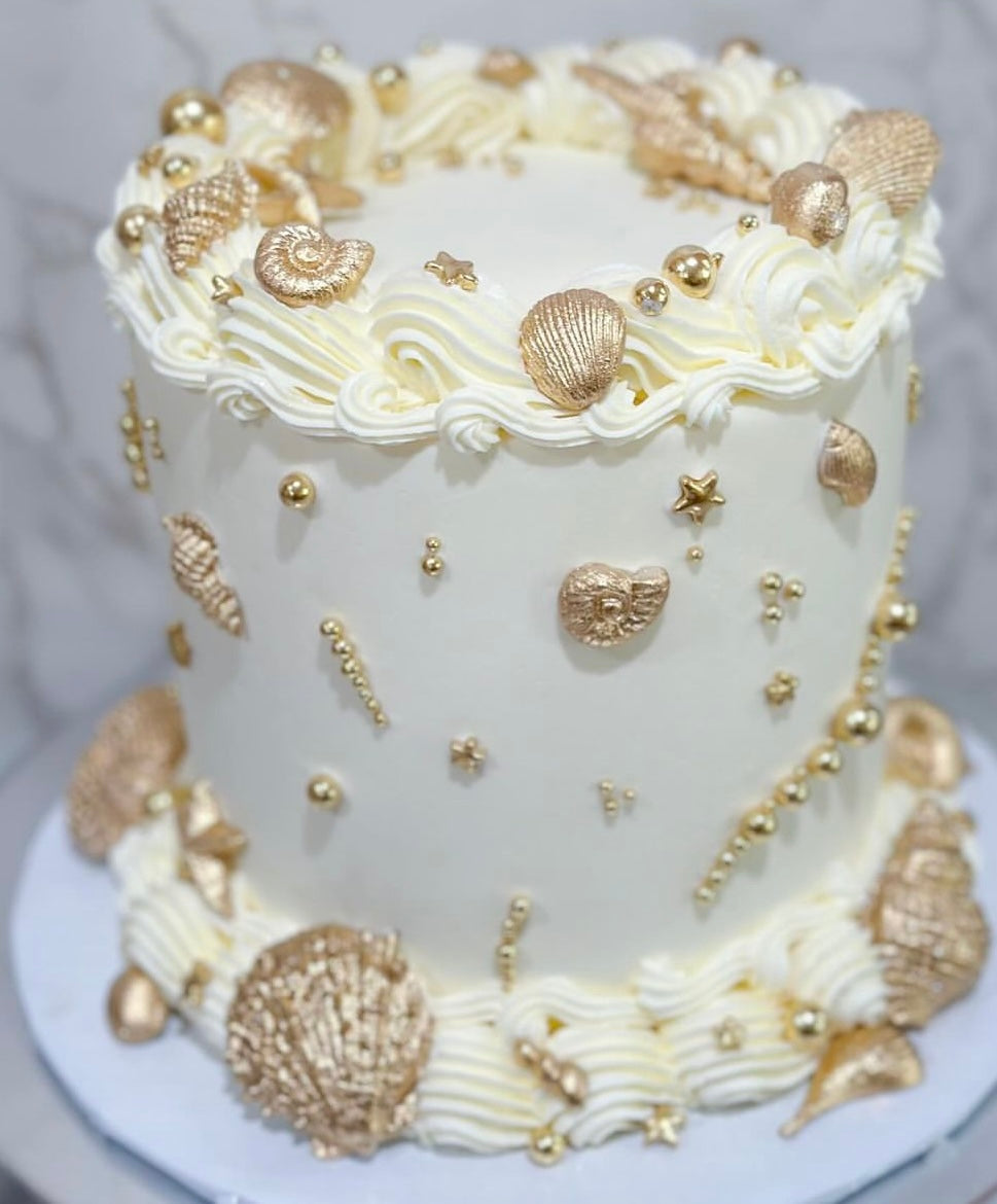 Gold sea shell cake