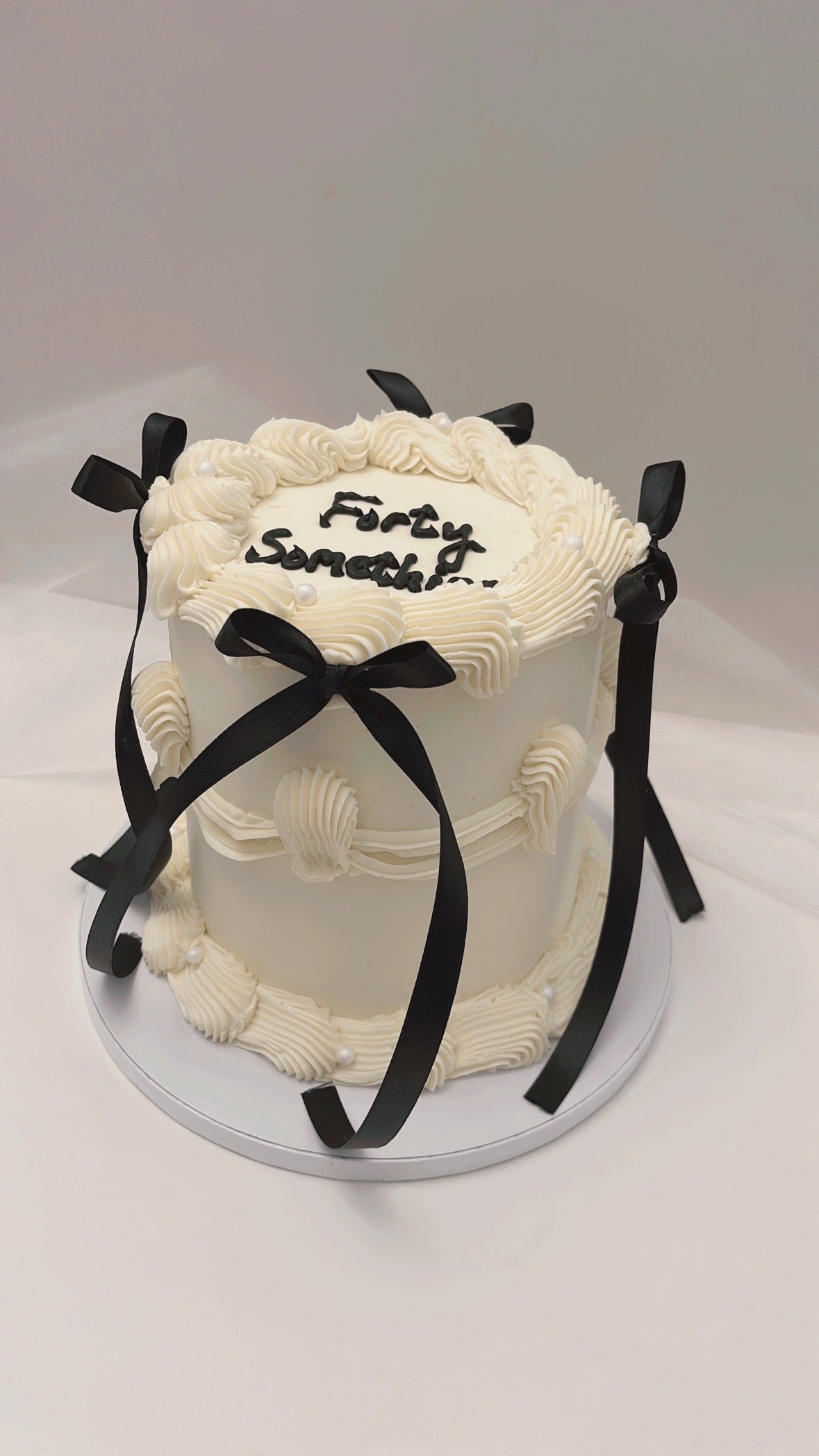 Black bow Lambeth cake