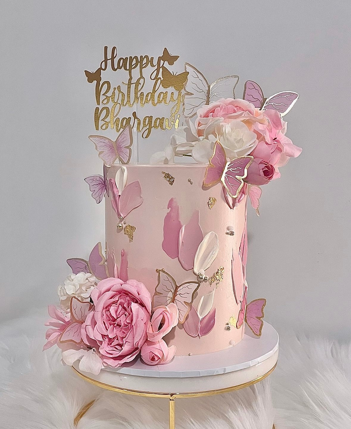 Pink floral butterfly cake