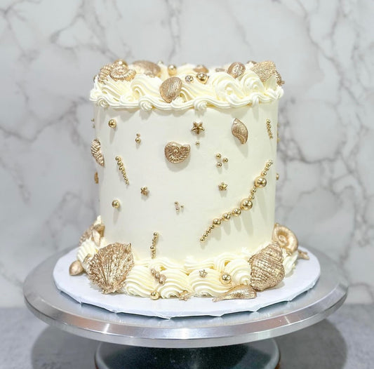 Gold sea shell cake